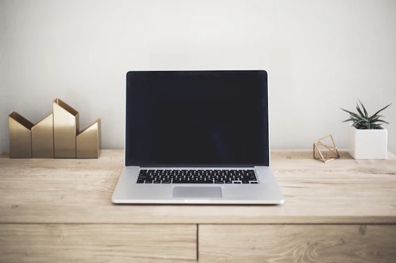 Laptop showing a website on a desk